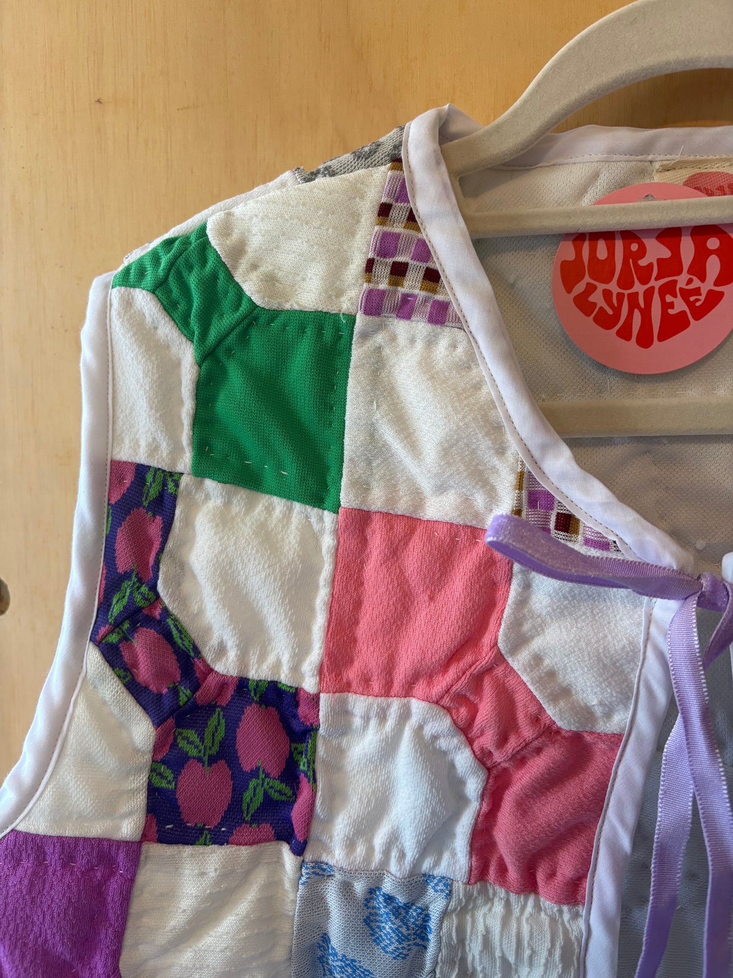 Rainbow Quilted Vest with Purple Bow