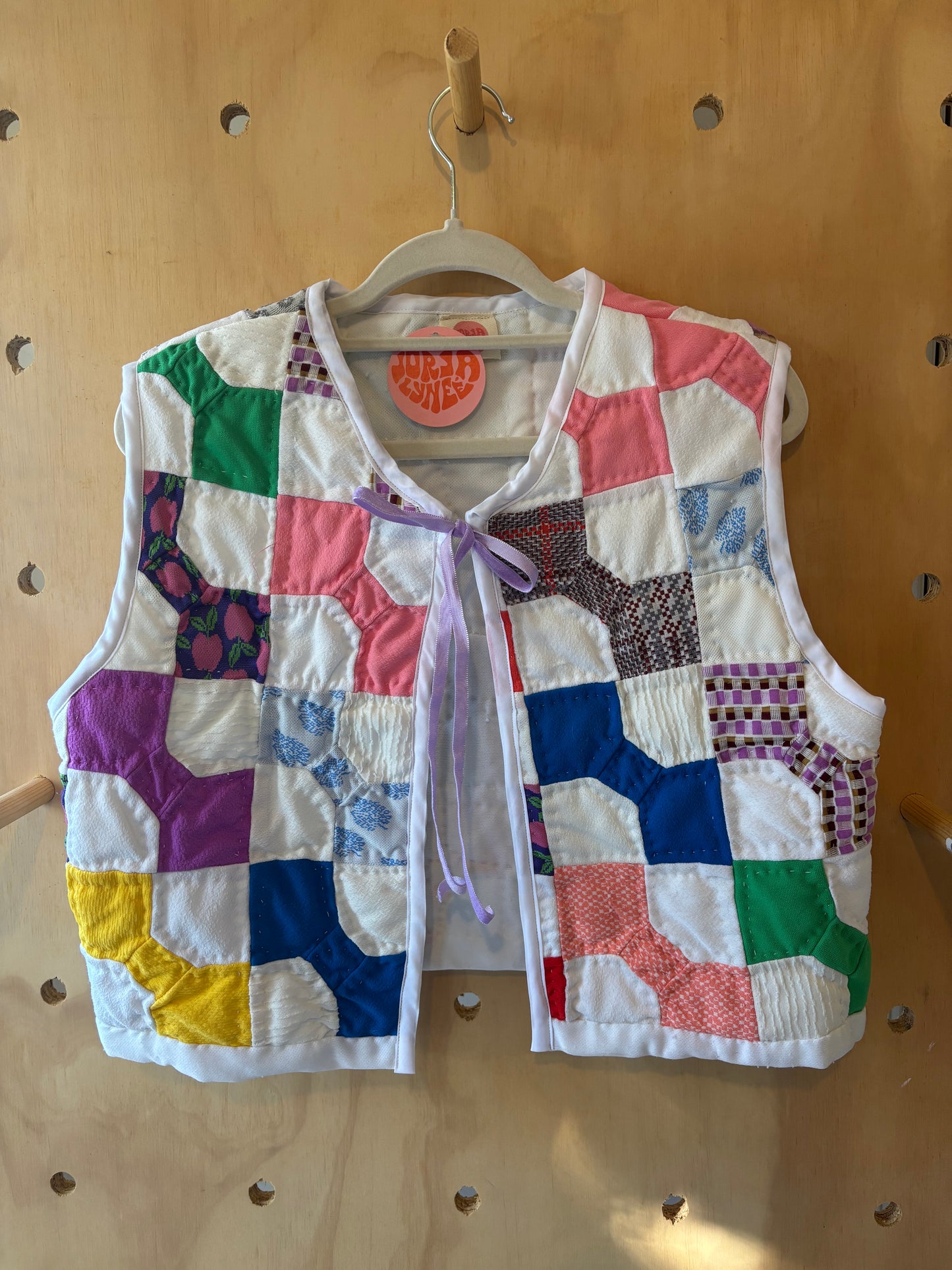 Rainbow Quilted Vest with Purple Bow
